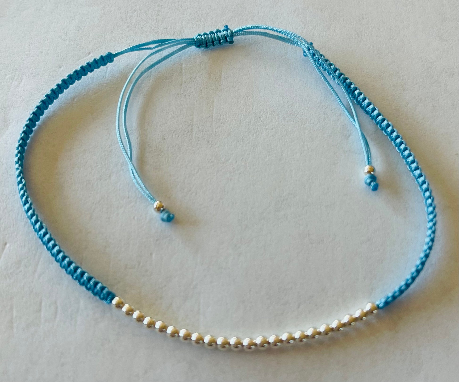 Sterling Silver Ball Beads on Braided Sky Blue Cording Bracelet Media 3 of 12